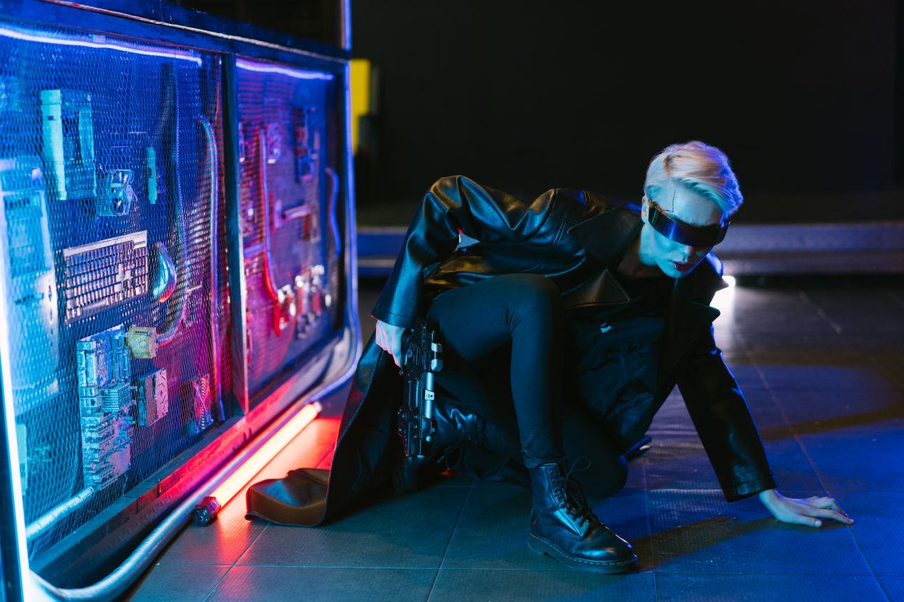 A stylish cyberpunk woman crouching in futuristic neon-lit setting with a gun.